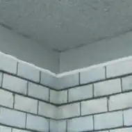 Wall ceiling corner with expansion joint seal